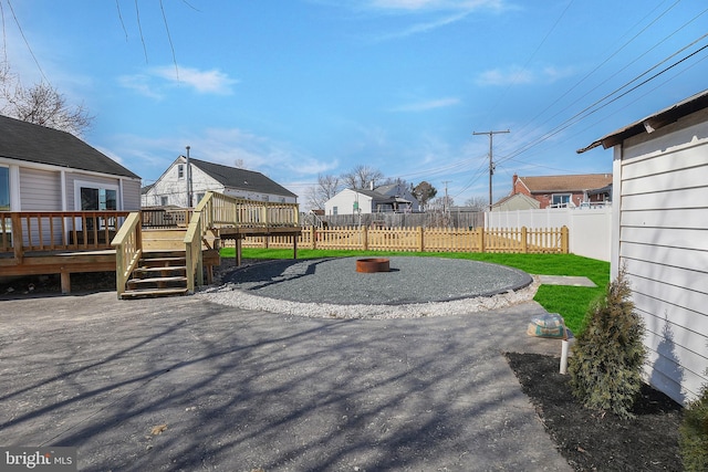 exterior space featuring fence and a deck