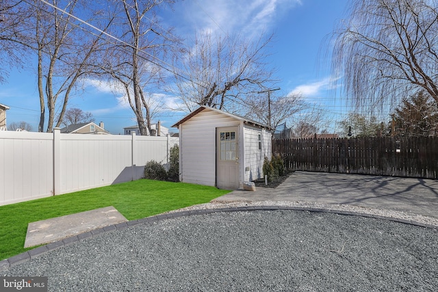 view of shed featuring a fenced backyard