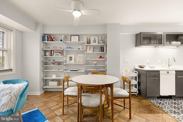 dining room featuring ceiling fan and baseboards