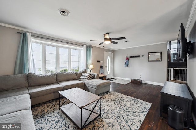 living area with baseboards, visible vents, a ceiling fan, wood finished floors, and crown molding