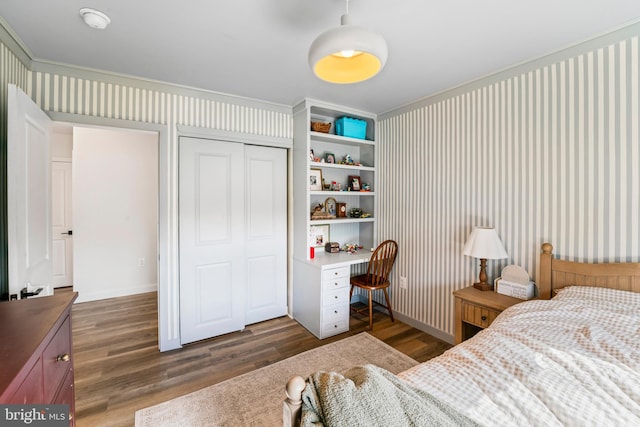 bedroom featuring a closet and wood finished floors