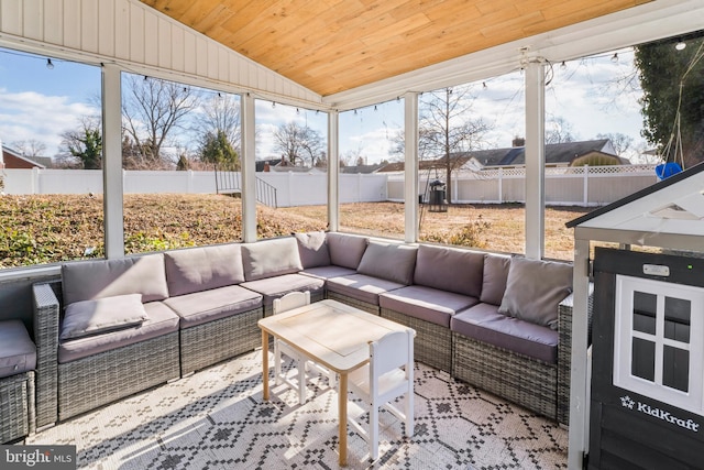 sunroom / solarium with lofted ceiling and wood ceiling