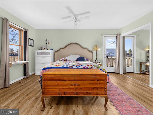 bedroom featuring light wood-type flooring, access to outside, ceiling fan, and baseboards