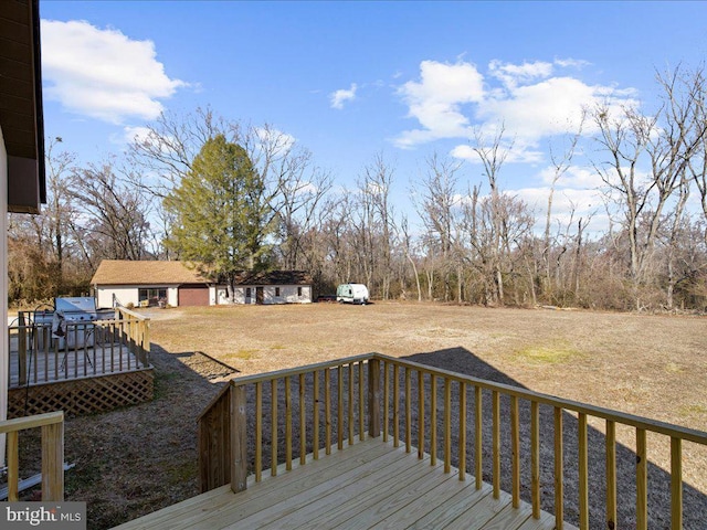 deck featuring a lawn and area for grilling