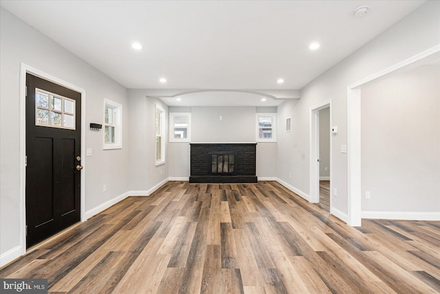 interior space with recessed lighting, baseboards, and wood finished floors