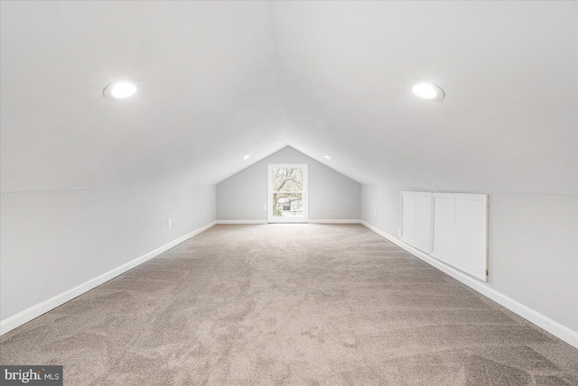 bonus room featuring lofted ceiling, carpet, baseboards, and recessed lighting