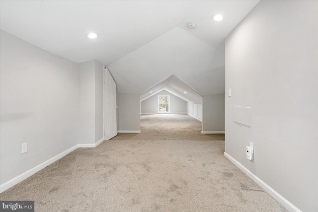 bonus room featuring carpet, vaulted ceiling, baseboards, and recessed lighting