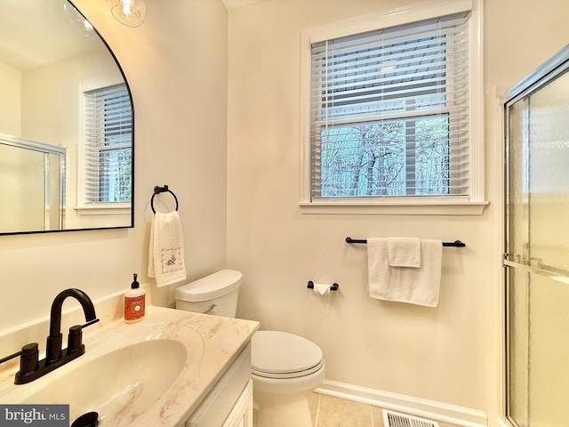 full bath featuring toilet, vanity, visible vents, tile patterned floors, and an enclosed shower