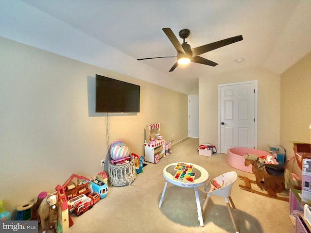 rec room with carpet floors, lofted ceiling, and a ceiling fan