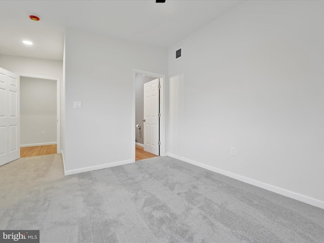 unfurnished bedroom featuring carpet flooring and baseboards