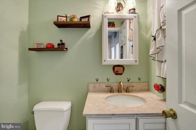 bathroom with vanity and toilet