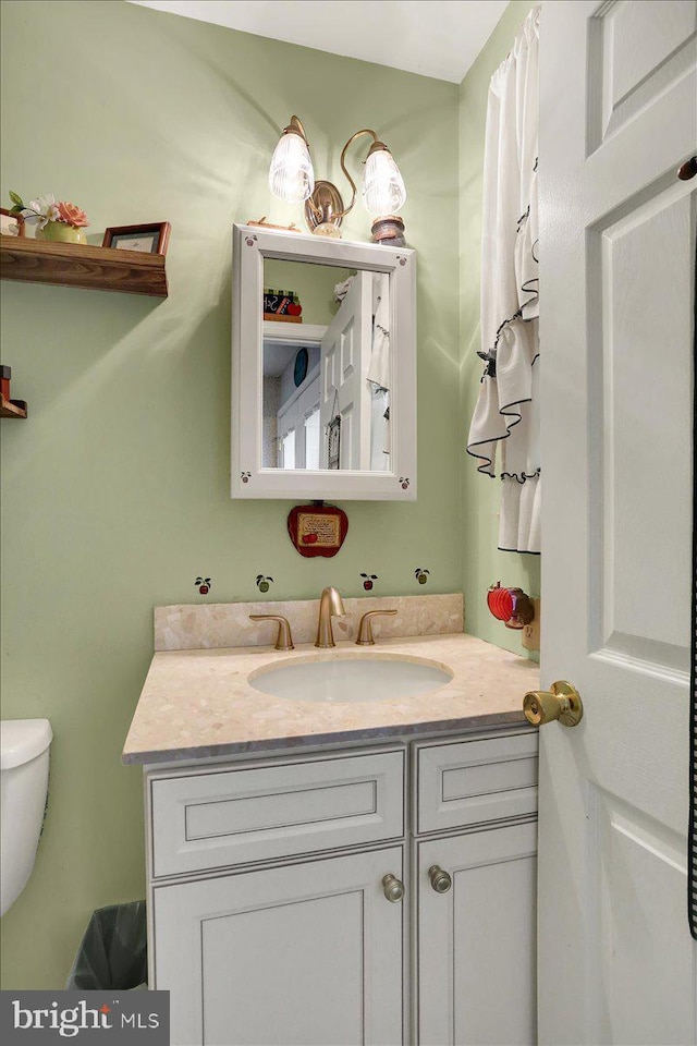 bathroom with vanity and toilet