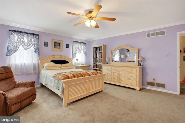 bedroom featuring visible vents, crown molding, light carpet, and baseboards