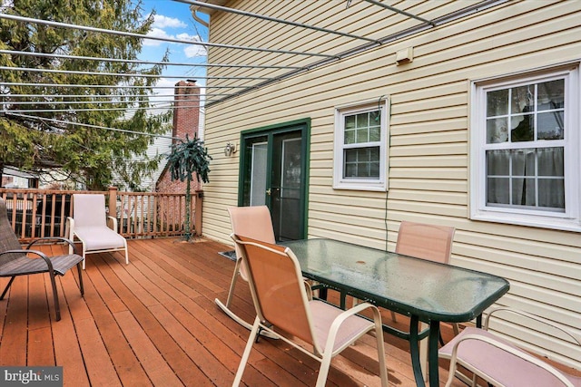 wooden deck with outdoor dining area