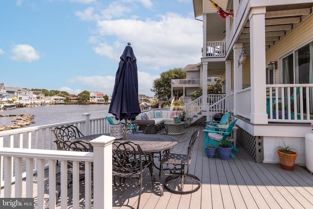 deck featuring a water view