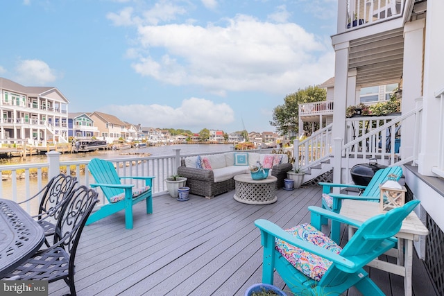 wooden deck featuring a water view