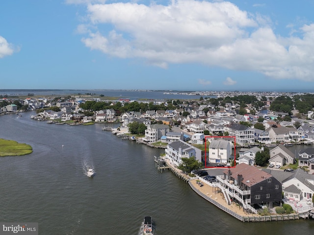 bird's eye view with a residential view and a water view