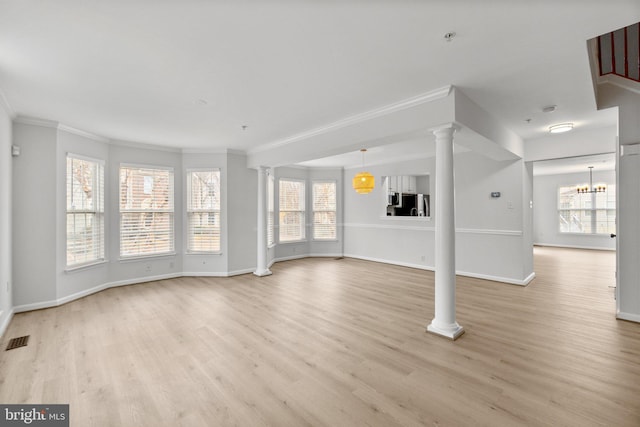 unfurnished living room with visible vents, baseboards, light wood-style flooring, ornamental molding, and ornate columns