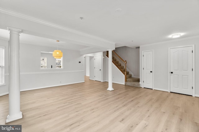 below grade area with baseboards, light wood finished floors, stairway, and crown molding