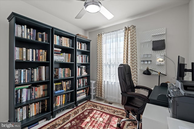 home office featuring visible vents and a ceiling fan