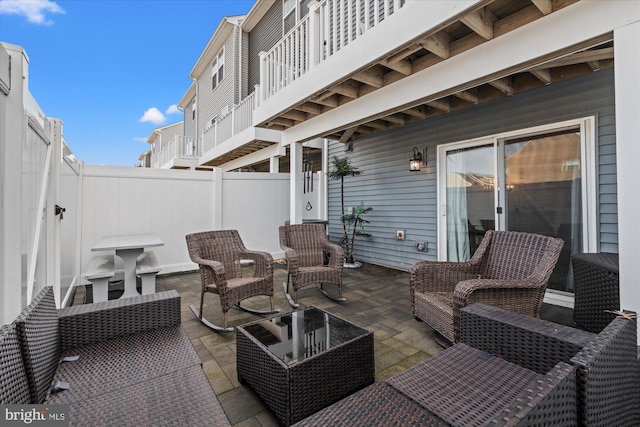 view of patio featuring a fenced backyard and an outdoor living space