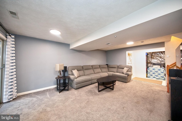 carpeted living area with a textured ceiling, visible vents, and baseboards