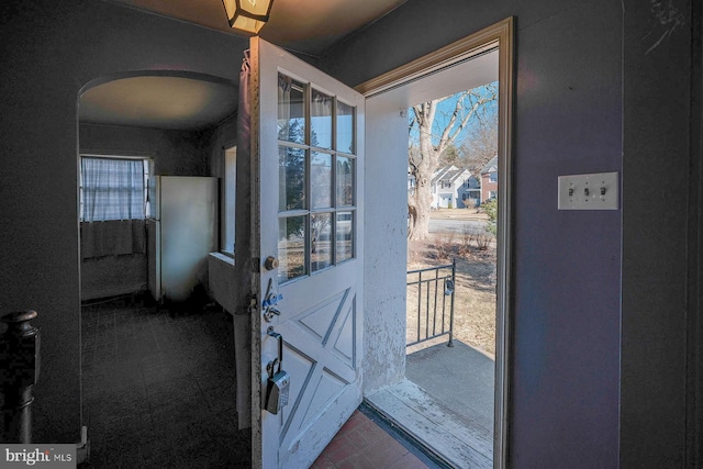 doorway to outside with arched walkways