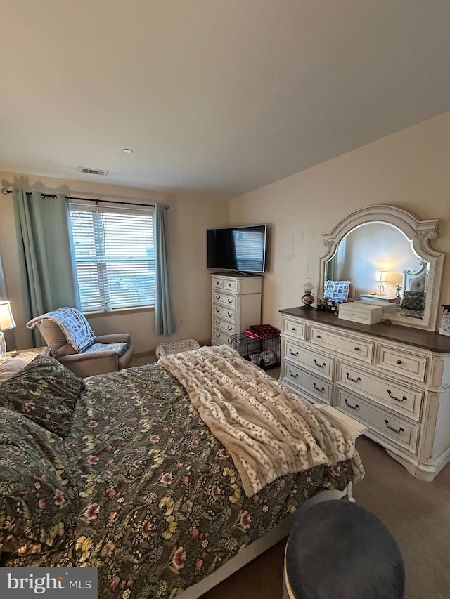 bedroom featuring carpet and visible vents