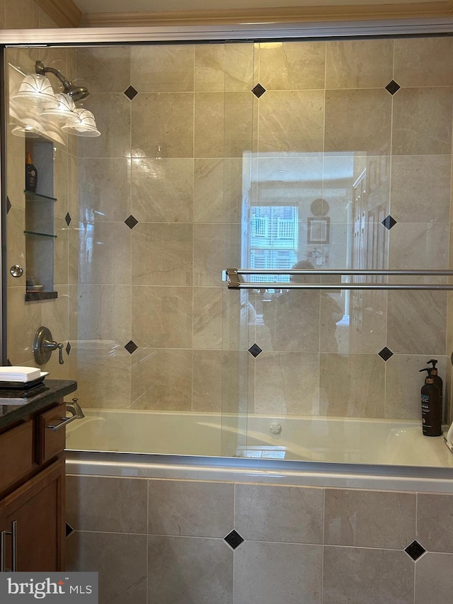 full bathroom featuring tiled shower / bath and vanity