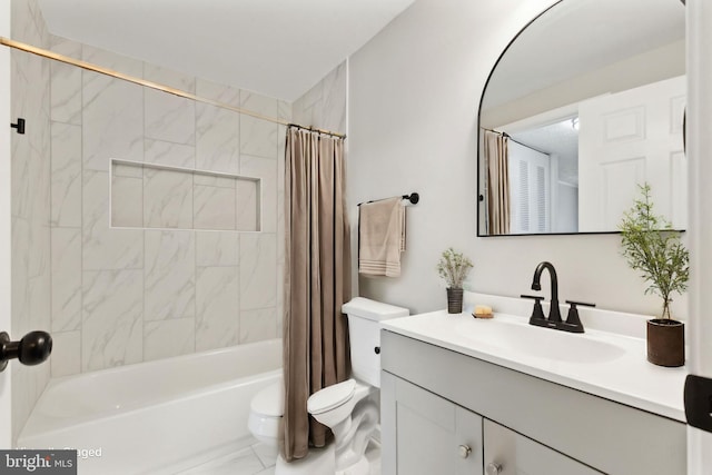 bathroom featuring vanity, toilet, and shower / bath combo with shower curtain