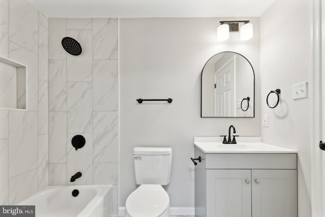 bathroom with vanity,  shower combination, toilet, and baseboards