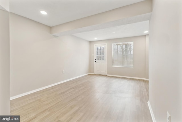 unfurnished room featuring recessed lighting, baseboards, and wood finished floors