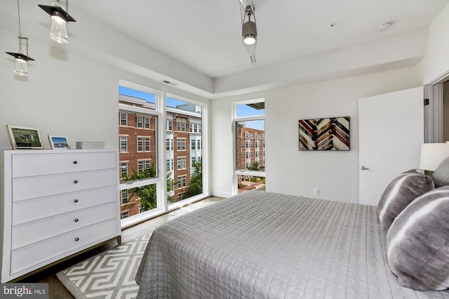 bedroom featuring access to outside and visible vents