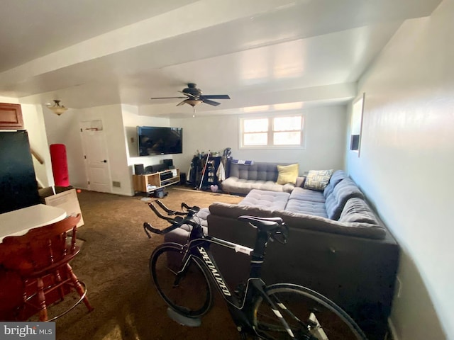 carpeted living area featuring a ceiling fan