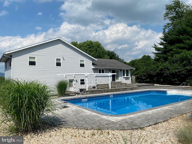 pool featuring a pergola and a patio