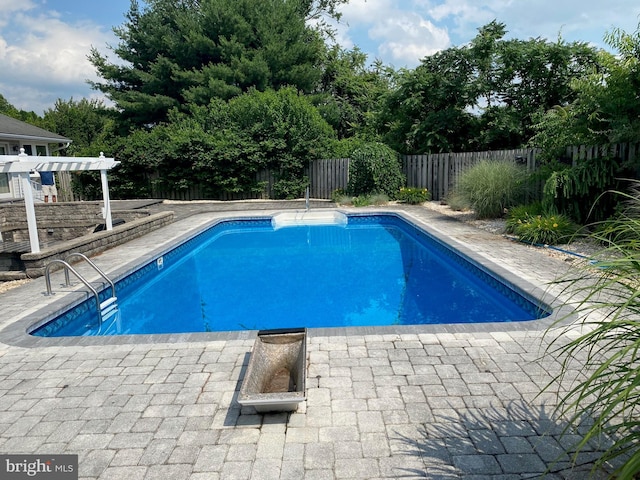 view of pool with a fenced in pool, a patio area, a fenced backyard, and a pergola