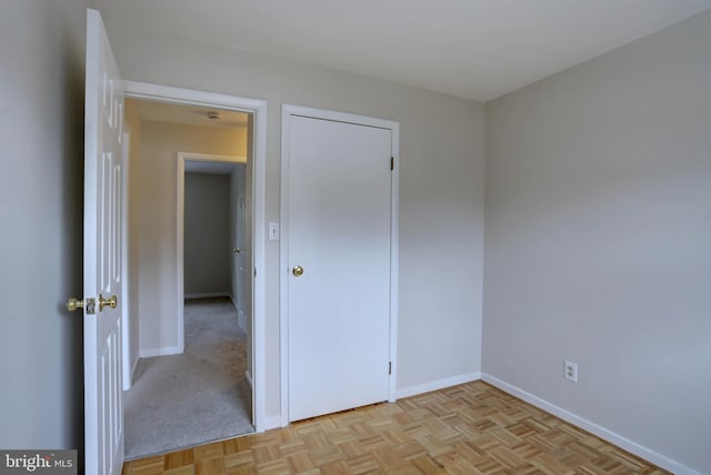 unfurnished bedroom featuring baseboards