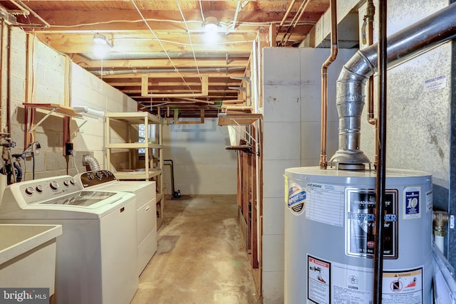 unfinished below grade area with washer and dryer, water heater, and a sink