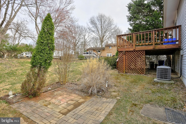 view of yard featuring a deck and cooling unit