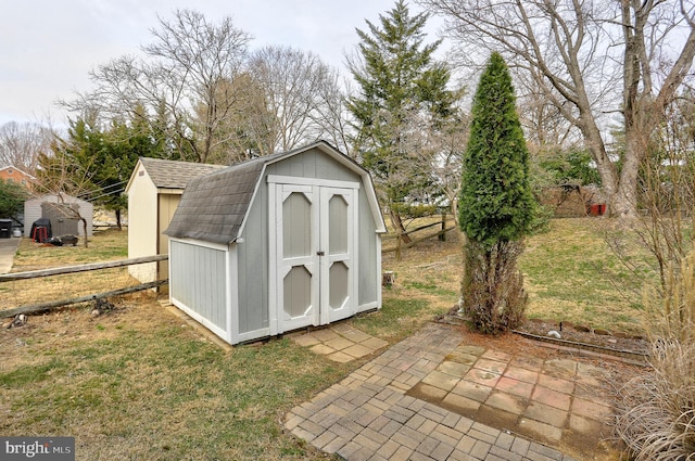 view of shed with fence