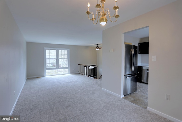 unfurnished living room with light colored carpet and baseboards