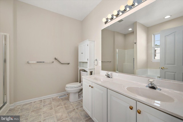 bathroom with baseboards, a sink, and a stall shower