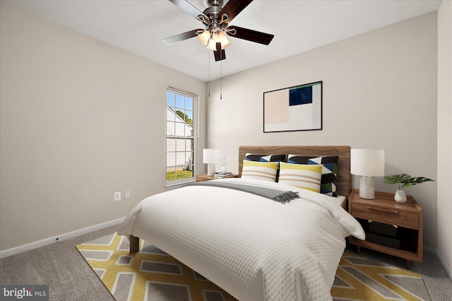 bedroom featuring carpet floors, baseboards, and ceiling fan