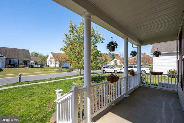 view of patio with a residential view and covered porch