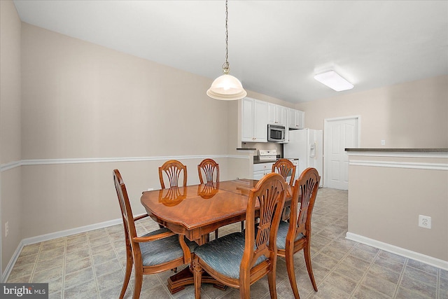 dining room with baseboards