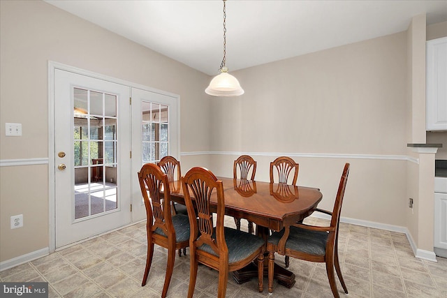 dining space featuring baseboards