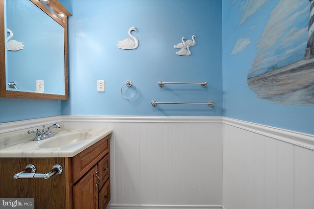 bathroom with wainscoting and vanity
