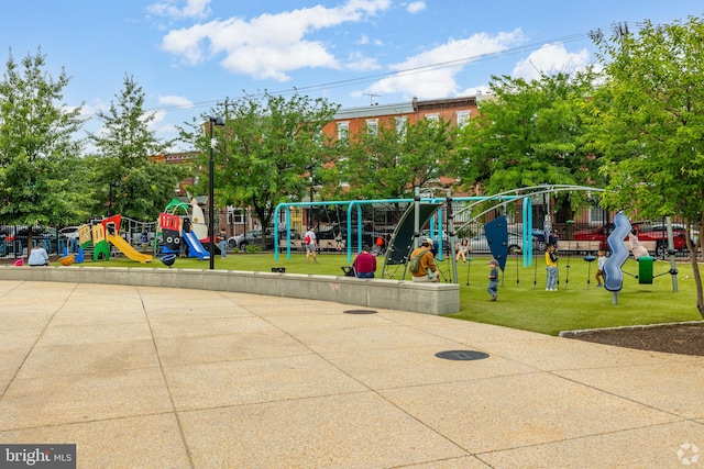 community play area with a lawn