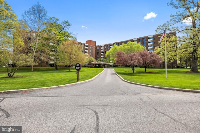 view of home's community featuring a lawn