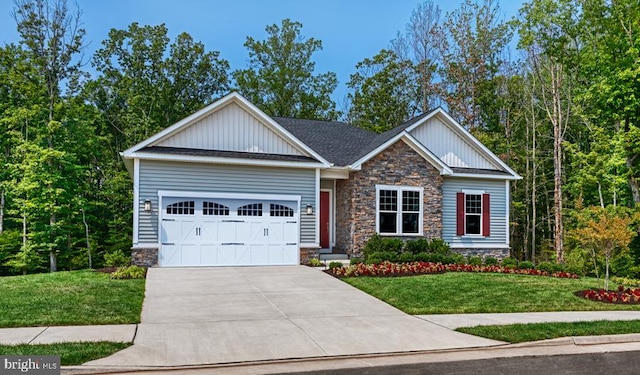 craftsman-style home featuring a garage, stone siding, concrete driveway, board and batten siding, and a front yard